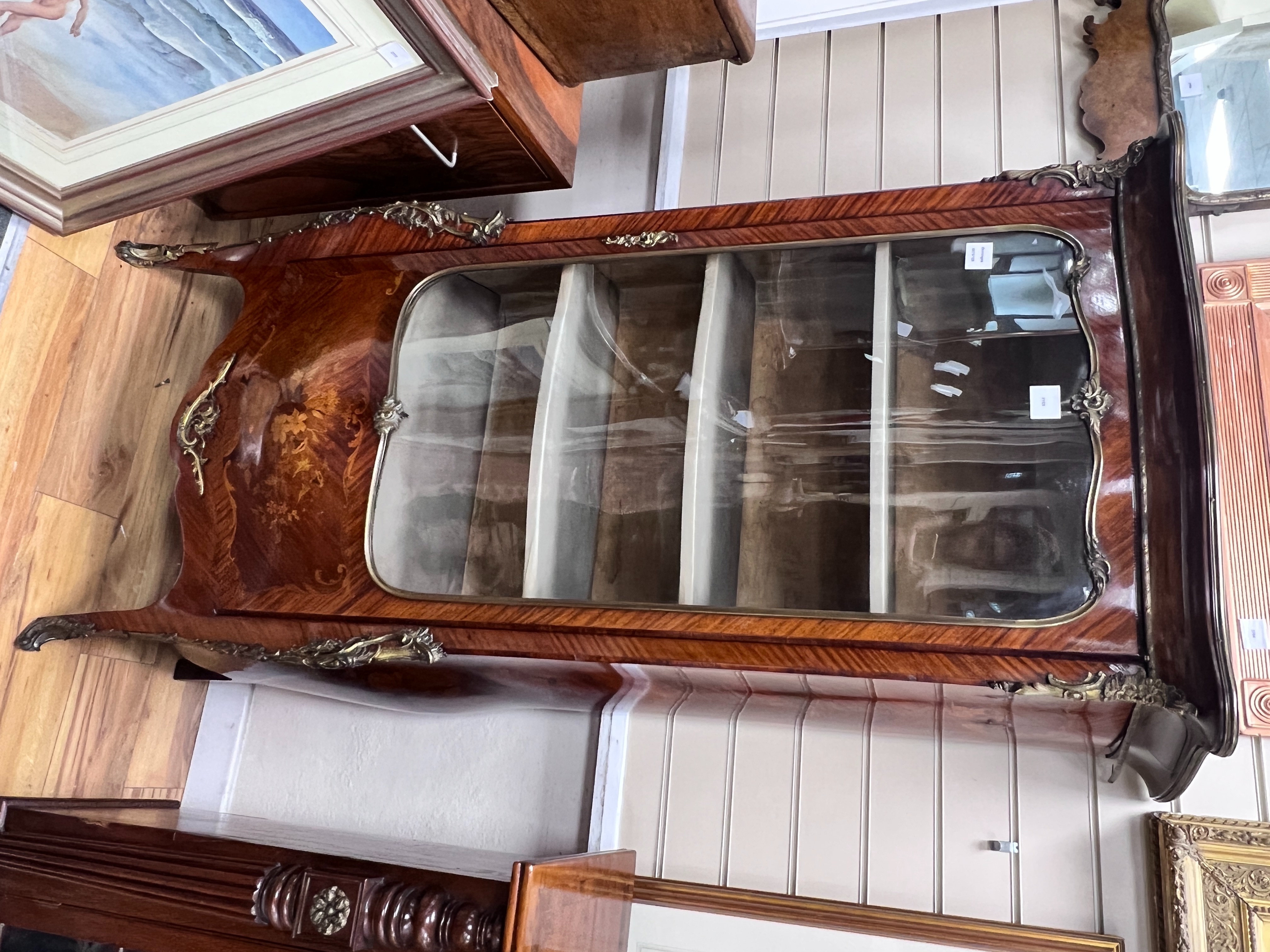 A Louis XVI style gilt metal mounted marquetry inlaid kingwood bombe vitrine, width 86cm, depth 40cm, height 160cm